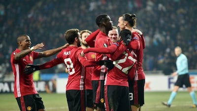 Manchester United FC players celebrate after scoring a goal during the Europa League match against Zorya Luhansk. AFP