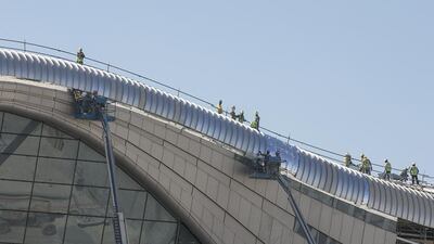 Construction crew continue work at Midfield Terminal in December last year. Mona Al Marzooqi / The National