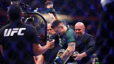 Tom Aspinall receives the interim heavyweight belt from UFC president Dana White after defeating Sergei Pavlovich. AFP