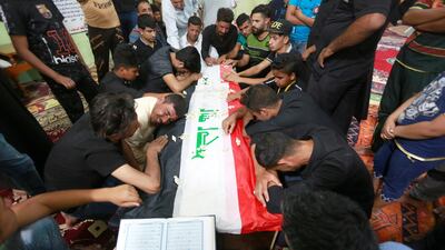 Mourners attend the funeral of Iraqi security men who were kidnapped and killed by ISIS militants, in Karbala on June 28, 2018. Alaa Al Marjani / Reuters