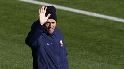 Barcelona manager Luis Enrique waves to the crowd during a training session. Manu Fernandez / AP