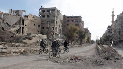 Syria's hospitality industry has been hit by the ongoing conflict. Above, damaged structures in Damascus. Bassam Khabieh / Reuters