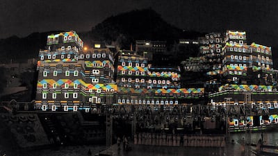 At night the town's old stone buildings light up, with an elaborate video-mapping performance projected on to them.
