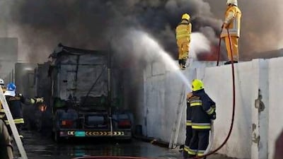 Firefighters battle a blaze in the Sharjah Industrial Area earlier this month.