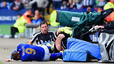 Mike Williamson of Newcastle United fouls Jamie Vardy of Leicester City leading to his red card during their Premier League match on Saturday. Ross Kinnaird / Getty Images