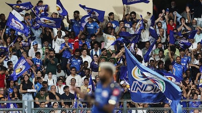 Mumbai fans in the Wankhede Stadium celebrate the wicket of Kolkata's Angkrish Raghuvanshi for 51. Reuters