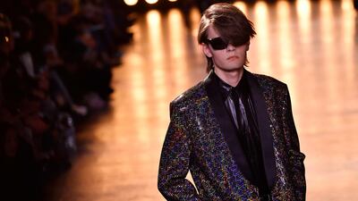 Animal print jackets were paired with shiny shirts. AFP