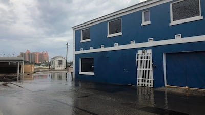 View of a flooded street with Atlantis resort in the background in Downtown, Nassau . AFP