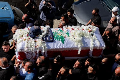 Mourners carry the coffin of journalist Amal Khalil Baisariyeh. Reuters
