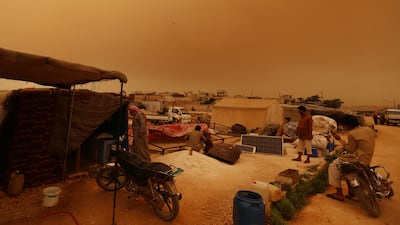 The rebel-held town of Dana is coated in dust and sand.