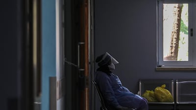 A Member of the clinical staff wearing Personal Protective Equipment rests outside the intensive care unit at the European Hospital, east of Rafah town, southern Gaza strip, 30 November 2020. The European Hospital, which has been classified as the Epidemiology Hospital since the start of the coronavirus in the Gaza Strip on 25 August 2020, has 334 infected cases under clinical care including 109 severe and critical cases. The production capacity of oxygen is 2,200 liters per minute, and there has become a large deficit after the increasing number of infections with Coronavirus. EPA/MOHAMMED SABER
