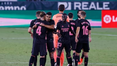 Real Madrid players celebrate at the end of the match. Reuters