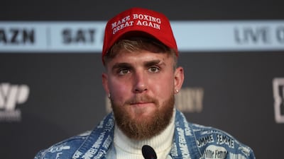 Boxing co-promoter Jake Paul wears a "Make Boxing Great Again" cap during a press conference at the Leadenhall Building in London, on the second leg of the press tour to promote the upcoming fight between Ireland's Katie Taylor and Puerto Rico's Amanda Serrano, Monday, Feb. 7, 2022. In one of the biggest events in women's boxing history Katie Taylor will defend her lightweight titles against Amanda Serrano on April 30 in what organizers say will be the first women's boxing match to headline Madison Square Garden. (AP Photo / Ian Walton)