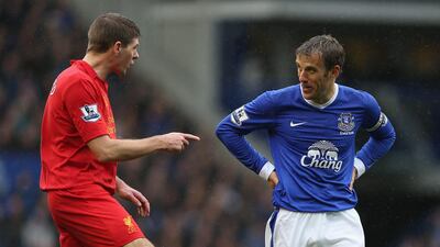 Steven Gerrard of Liverpool has words with Everton's Phil Neville during the Merseyside derby. Clive Brunskill/Getty Images