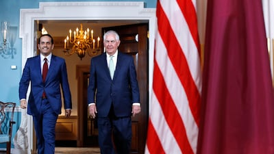 US secretary of state Rex Tillerson walks with Qatar's foreign minister Sheikh Mohammed bin Abdulrahman Al Thani. Washington is likely to push for an early resolution based on Gulf Arab reconciliation. AP Photo / File
