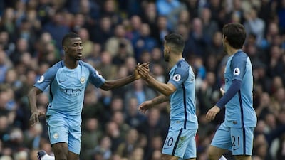 Kelechi Iheanacho, left, celebrates with Sergio Aguero, centre, after scoring Manchester City's equaliser against Southampton. Peter Powell / EPA