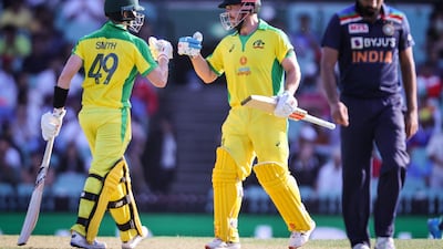 Australia's captain Aaron Finch, centre, and Steve Smith scored centuries against India in Sydney. AFP