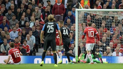Manchester United's Michael Carrick shown scoring an own goal to give Club Brugge an initial 1-0 lead in their Champions League play-off first leg match on Tuesday at Old Trafford. Oli Scarff / AFP