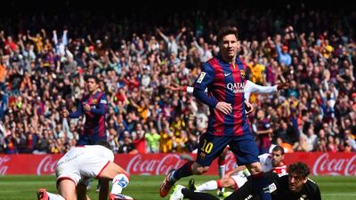 Lionel Messi scores his second and Barcelona's fourth goal against Rayo Vallecano on March 8. David Ramos / Getty Images