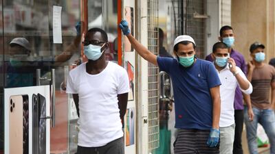More pharmacies in Dubai have been penalised for illegally increasing the price of protective equipment during the coronavirus outbreak. AFP