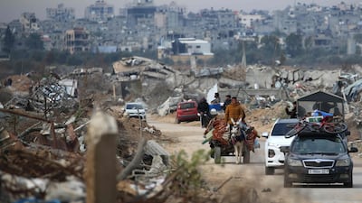 Displaced Palestinians cross the Netzarim Corridor as they make their way to the northern parts of Gaza. AFP