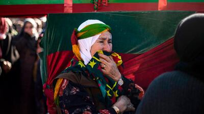 A woman mourns at a funeral for two Syrian Democratic Forces (SDF) fighters in the Syrian Kurdish-majority city of Qamishli, after they were killed by a Turkish military drone, according to Kurdish security officials. AFP