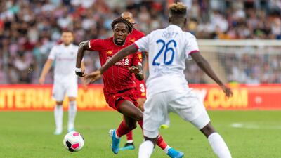 Liverpool's Divock Origi, left, fights for the ball with Lyon's Oumar Solet. AP Photo