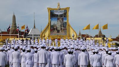 Thai caretaker Prime Minister Prayut Chan-o-cha leads the salute to the portrait of Thai King Maha Vajiralongkorn Bodindradebayavarangkun on the monarch's birthday, in Bangkok. EPA