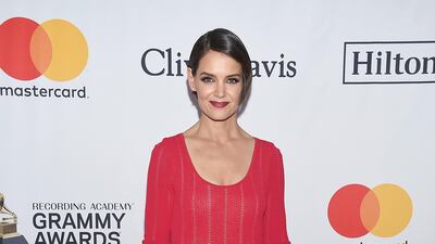 Katie Holmes sat next to partner Jamie Foxx at the 2018 Pre-Grammy Gala And Salute To Industry Icons, and wore a simple striped red dress for the occasion. Evan Agostini / AP