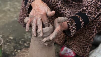 About 450 families make a living from pottery in the village, but only women perform the ancient craft.