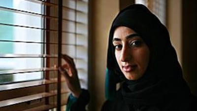 Maha Al Kaabi, a business student at Al Ain Women's College, help to gather information about locals and the private sector.