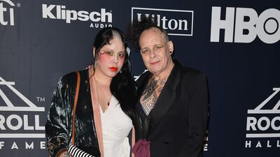 Inductee English musician Pearl Thompson, right, of The Cure attends. AFP