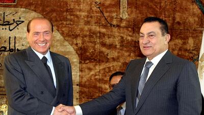 Egyptian President Hosni Mubarak shakes hands with Mr Berlusconi in Cairo in June 2003. Mr Berlusconi urged Israel to show 'greater wisdom' after its failed attempt to assassinate a radical Palestinian leader. AFP