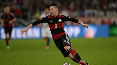 Mesut Ozil and Germany beat Chile 1-0. They'll play in Group G at the 2014 World Cup with Portugal, Ghana and United States. Patrik Stollarz / AFP