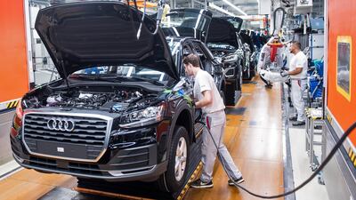A worker assembles a front seat in a new Audi at the car manufacturer's plant in in Ingolstadt, Bavaria. Audi's parent Volkswagen is understood to be mulling a partnership with China's SAIC Motor to build one of its models in China. EPA