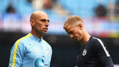 Willy Cabellero of Manchester City (L) and Joe Hart (R) warm up prior to kick off during the Premier League match between Manchester City and Sunderland at Etihad Stadium on August 13, 2016 in Manchester, England. Stu Forster / Getty Images
