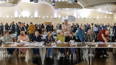 Election staff count votes during the Havering local council election in Romford, England. Getty Images