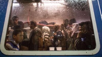 Refugees crowd on to a train travelling from Gyor to Hegyeshalom, Hungary, on Saturday. Croatia has bussed hundreds of people to its border with Hungary, increasing tensions between the two countries over the handling of migrants. Vladimir Simicek/AFP
