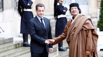 Former French president Nicolas Sarkozy welcomes former Libyan leader Muammar Qaddafi at Le Palais de l'Elysee on December 10, 2007 in Paris, France. Michel Dufour / WireImage