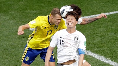 South Korea's Ki Sung-yueng, right, and Sweden's Viktor Claesson challenge for the ball. Michael Sohn / AP Photo
