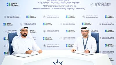 Capt Mohamed Al Shamisi, managing director and group chief executive of AD Ports Group, right, and Naser Al Yammahi, deputy chief executive of Hayat Biotech sign the agreement. Photo: AD Ports Group