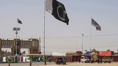 Pakistan and Taliban flags flutter on their respective border sides as seen from Chaman in Pakistan this week. AFP