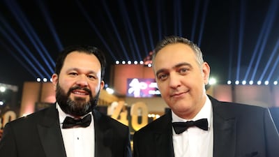 Cairo International Film Festival executive director Omar Kassem (L) and President Mohamed Hefzy pose on the red carpet at the closing ceremony of the 40th edition of the festival in Cairo. Photo / AFP