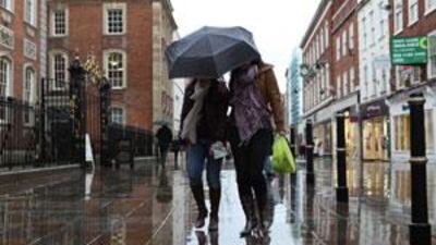 Shoppers brave the English winter weather in Worcester, where shopkeepers and residents are divided on the town twinning plan.