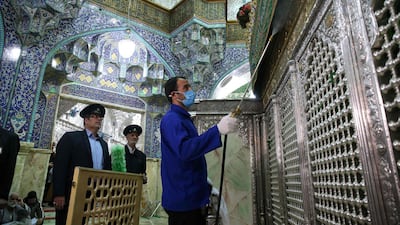 Iranian sanitary workers disinfect Qom's Masumeh shrine on February 25, 2020 to prevent the spread of the coronavirus which reached Iran. AFP