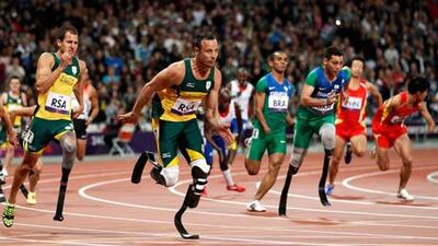 Arnu Fourie hands over to Oscar Pistorius in the final leg of their 4x100m relay at London 2012