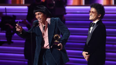 Anderson . Paak and Bruno Mars (R) of Silk Sonic accept the award for Record of the Year for 'Leave the Door Open' during the 64th Annual Grammy Awards. Reuters