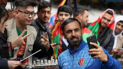 Afghanistan's Mohammad Nabi with fans during the T20 World Cup in Australia. AFP