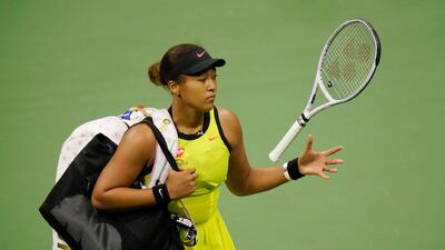Naomi Osaka, of Japan, tosses her racket to herself after losing. AP