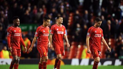 From right, Liverpool's Joe Allen, Dejan Lovren, Philippe Coutinho and Raheem Sterling walk off at the end of the match after drawing with Basel in their Uefa Champions League match at Anfield in Liverpool, England, on December 9, 2014. Peter Powell / EPA